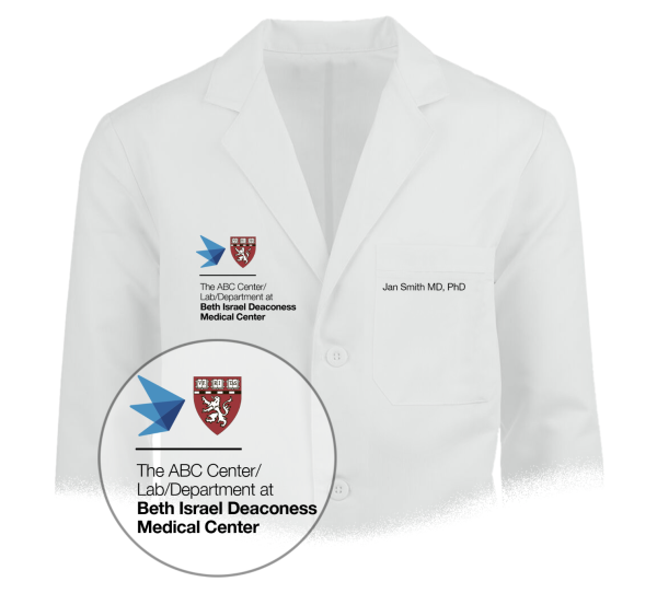 White coat example with Harvard Medical School and Affiliate icons placed on the left chest area with additional departmental name locked below, and person's name on opposite side of the chest